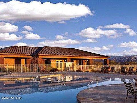 view of pool with fence