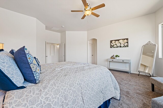 9896 E Wind Dancer Dr, Tucson, AZ 85748 - carpeted bedroom with visible vents, arched walkways, and ceiling fan