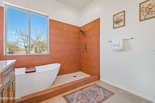 9896 E Wind Dancer Dr, Tucson, AZ 85748 - bathroom with vanity, a freestanding bath, tile patterned floors, and tiled shower