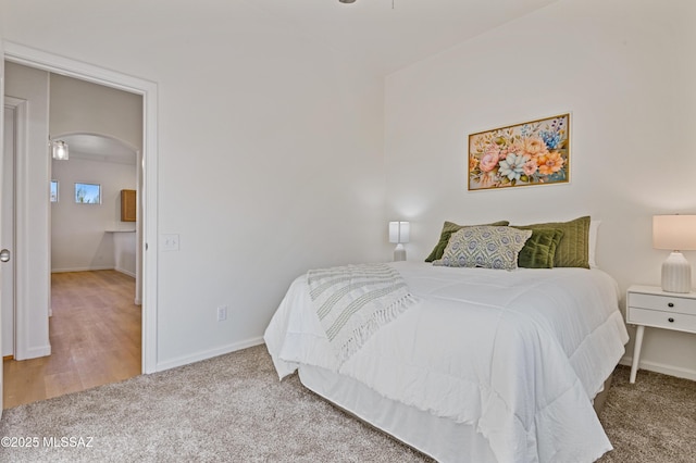 9896 E Wind Dancer Dr, Tucson, AZ 85748 - bedroom featuring arched walkways, baseboards, and carpet flooring
