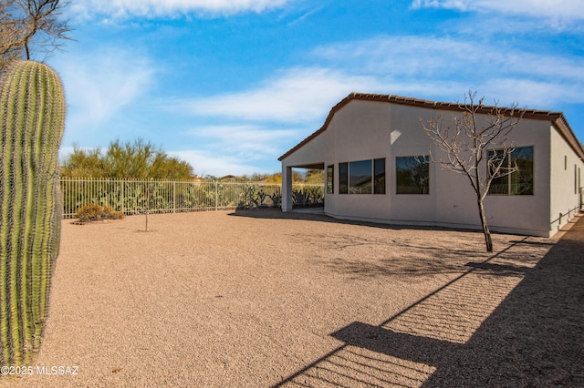 9896 E Wind Dancer Dr, Tucson, AZ 85748 - exterior space featuring fence and stucco siding