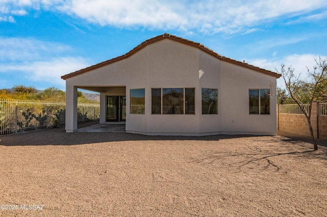 9896 E Wind Dancer Dr, Tucson, AZ 85748 - rear view of house with a patio, a fenced backyard, and stucco siding