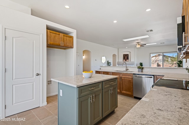 9896 E Wind Dancer Dr, Tucson, AZ 85748 - kitchen featuring stainless steel dishwasher, light tile patterned flooring, ceiling fan, arched walkways, and a sink