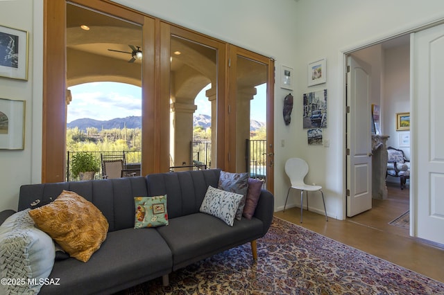4519 N Camino Kino, Tucson, AZ 85718 - living room featuring a mountain view, healthy amount of natural light, a ceiling fan, and baseboards