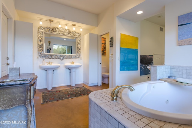4519 N Camino Kino, Tucson, AZ 85718 - bathroom with toilet and a whirlpool tub