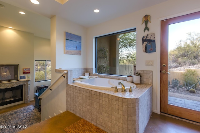 4519 N Camino Kino, Tucson, AZ 85718 - full bathroom with a garden tub, recessed lighting, and a glass covered fireplace