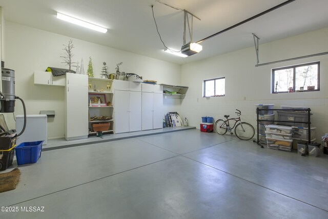 4519 N Camino Kino, Tucson, AZ 85718 - garage with a garage door opener and concrete block wall