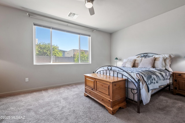 bedroom featuring carpet floors, a ceiling fan, baseboards, and visible vents