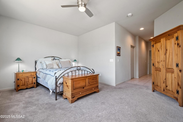 bedroom with light colored carpet, recessed lighting, baseboards, and ceiling fan