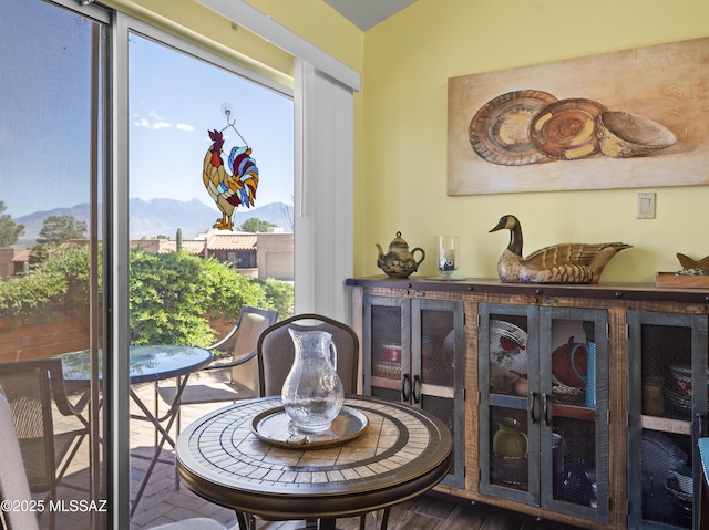 dining space featuring a mountain view and a healthy amount of sunlight
