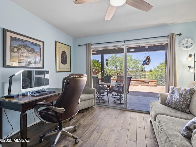 office space featuring ceiling fan, plenty of natural light, and wood finished floors