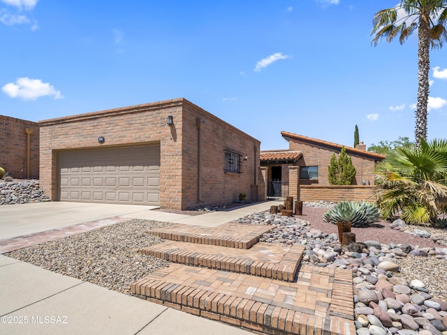 view of front of home with an attached garage and driveway