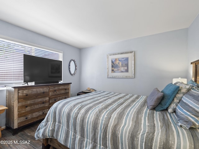 bedroom featuring dark wood-style floors
