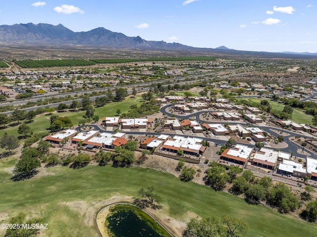 aerial view with view of golf course, a residential view, and a mountain view