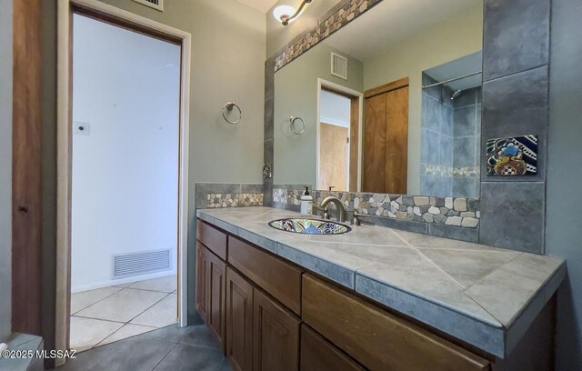 2102 E Florence Dr, Tucson, AZ 85719 - bathroom featuring tile patterned flooring and vanity