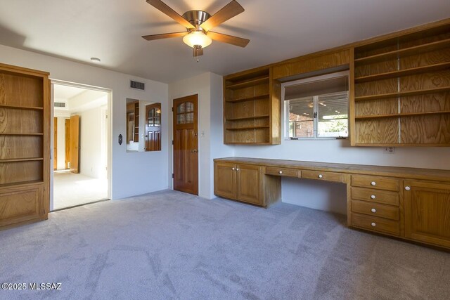 2102 E Florence Dr, Tucson, AZ 85719 - unfurnished office with built in study area, a ceiling fan, and carpet flooring