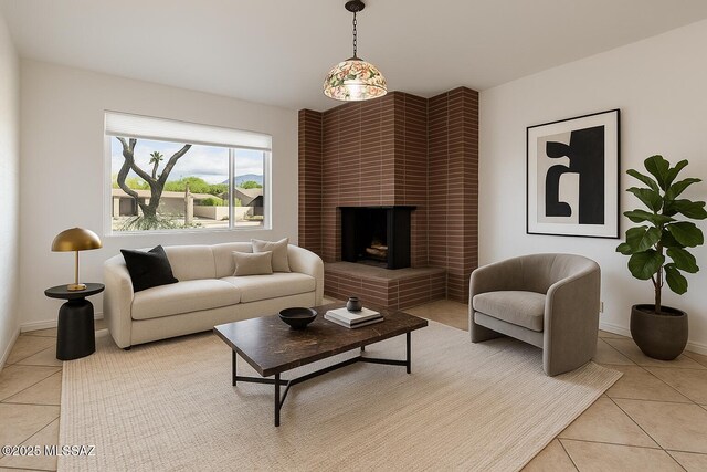 2102 E Florence Dr, Tucson, AZ 85719 - living area featuring light tile patterned floors, a brick fireplace, and baseboards