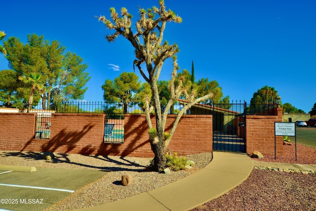 exterior space with fence and a gate
