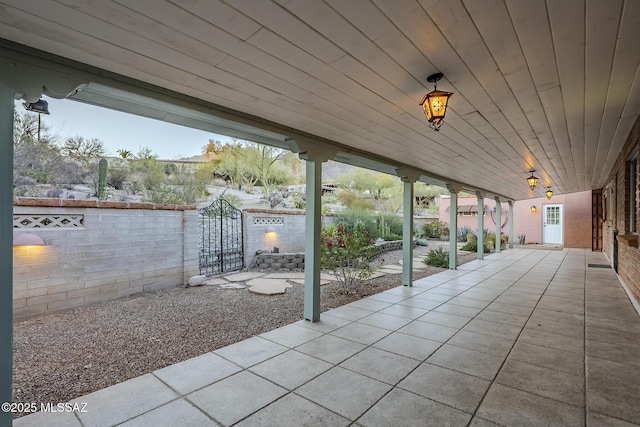 view of patio / terrace featuring a gate and fence