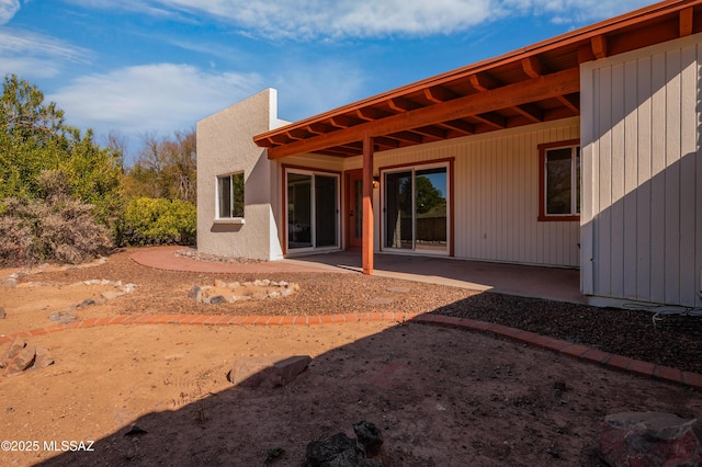 rear view of house featuring a patio