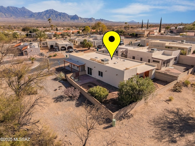 birds eye view of property with a residential view and a mountain view