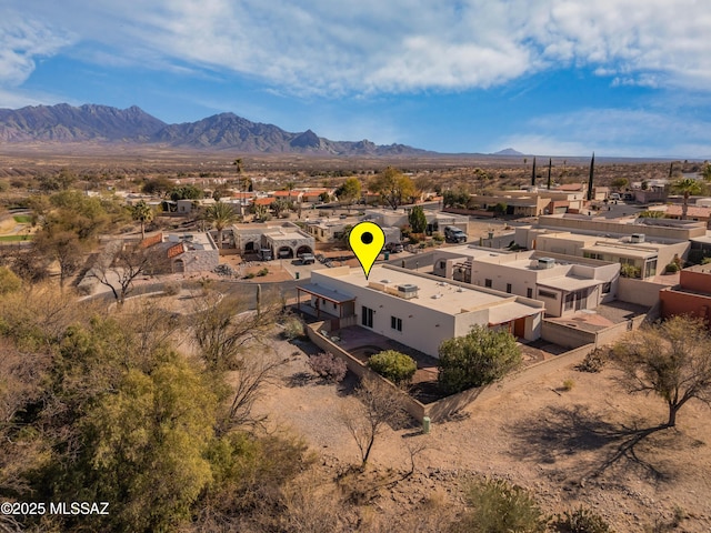 drone / aerial view featuring a residential view and a mountain view