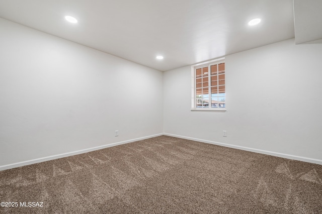 spare room featuring carpet floors, baseboards, and recessed lighting