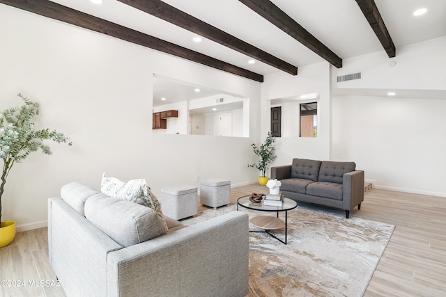 living area featuring baseboards, recessed lighting, wood finished floors, and visible vents