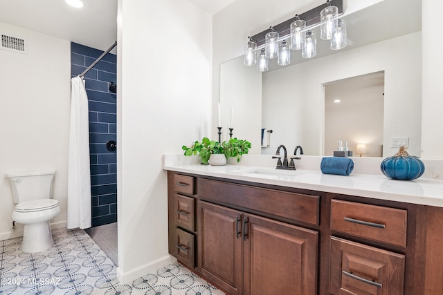 bathroom featuring visible vents, vanity, toilet, tiled shower, and recessed lighting