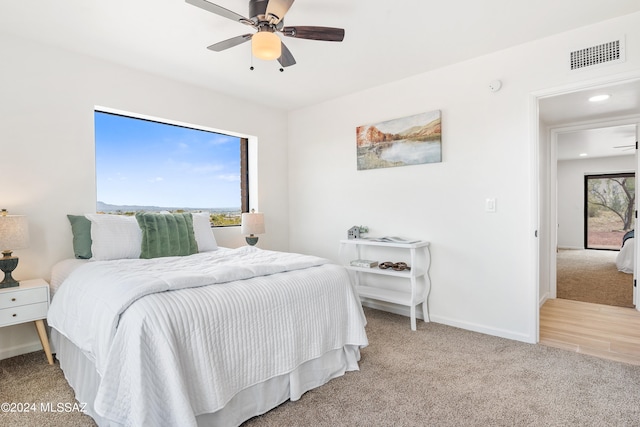 bedroom with ceiling fan, visible vents, baseboards, carpet flooring, and recessed lighting