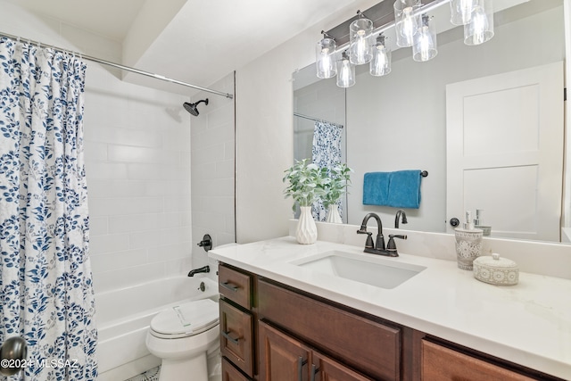bathroom with vanity, toilet, and shower / tub combo