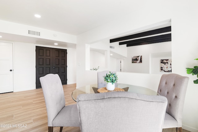dining area featuring recessed lighting, beamed ceiling, visible vents, and light wood-type flooring