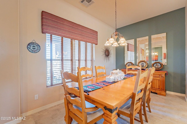 dining area with visible vents, baseboards, and an inviting chandelier