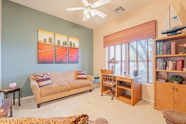 office featuring carpet floors, baseboards, a ceiling fan, and visible vents