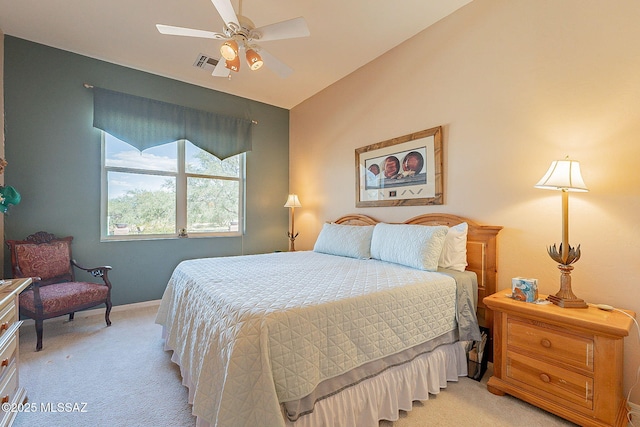 bedroom with visible vents, light carpet, baseboards, ceiling fan, and vaulted ceiling