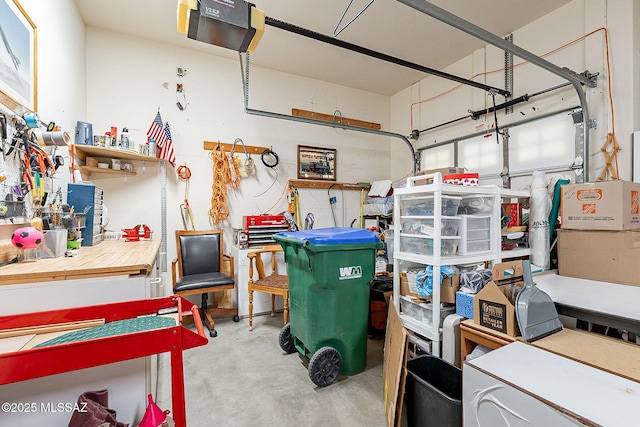 garage with a workshop area and a garage door opener
