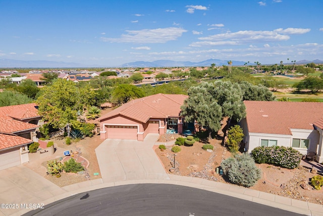 aerial view featuring a mountain view and a residential view