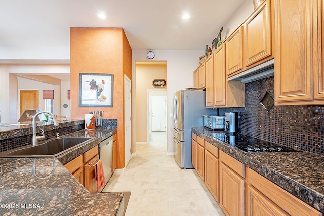 kitchen featuring exhaust hood, a sink, stainless steel appliances, tile countertops, and decorative backsplash