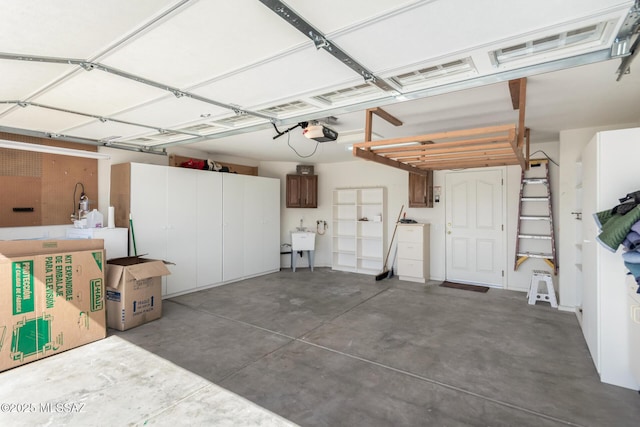 garage featuring a garage door opener