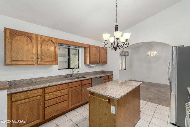 kitchen featuring a sink, stainless steel appliances, vaulted ceiling, a chandelier, and light tile patterned floors
