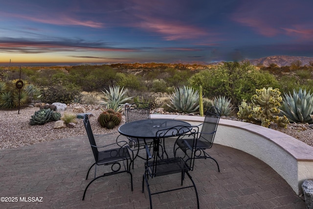 60333 E Ankole Dr, Oracle, AZ 85623 - patio terrace at dusk featuring a patio area and outdoor dining area