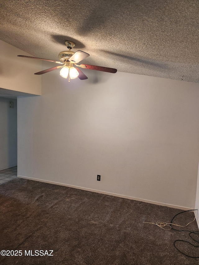 carpeted spare room with baseboards, ceiling fan, and a textured ceiling