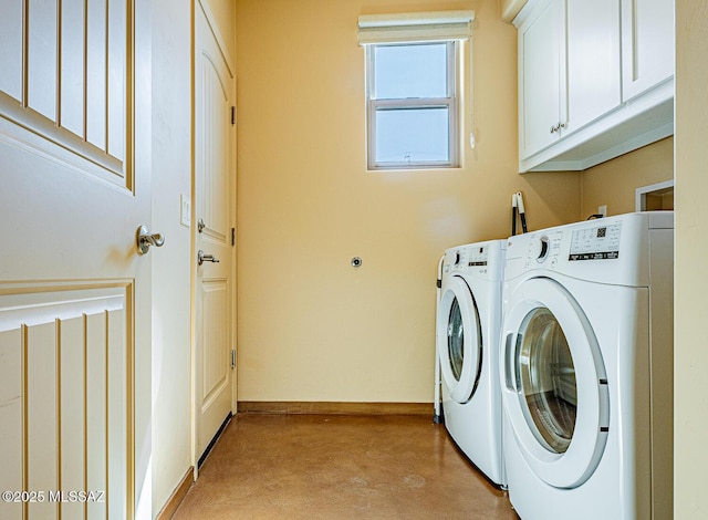 laundry room with cabinet space, independent washer and dryer, and baseboards