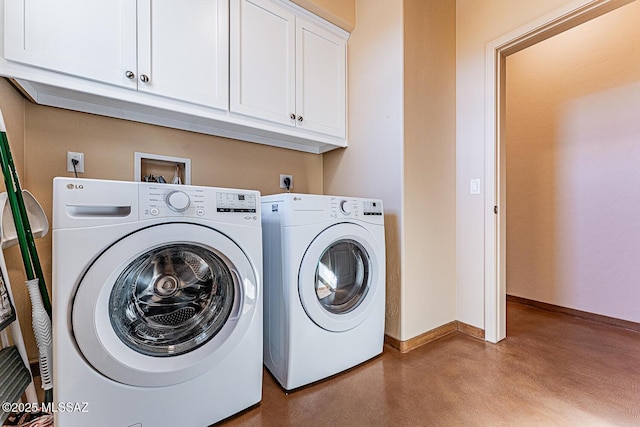 laundry room with cabinet space, separate washer and dryer, and baseboards