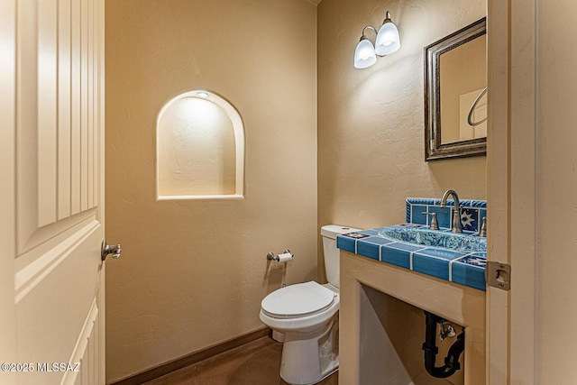 half bath with vanity and toilet
