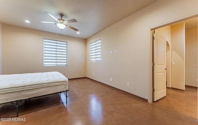 bedroom featuring concrete flooring, baseboards, recessed lighting, and a ceiling fan