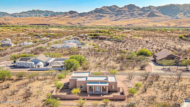 birds eye view of property with a mountain view
