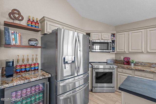 14171 N Gibson Trl, Tucson, AZ 85755 - kitchen featuring appliances with stainless steel finishes, open shelves, wine cooler, vaulted ceiling, and light wood finished floors