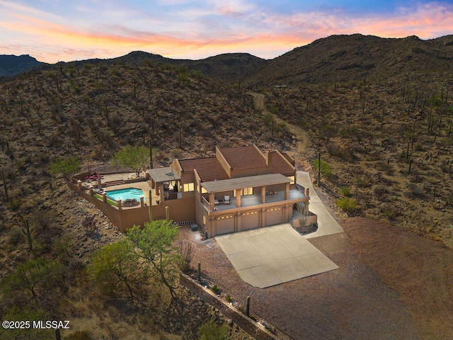 14171 N Gibson Trl, Tucson, AZ 85755 - aerial view at dusk of a mountain view and view of pool area