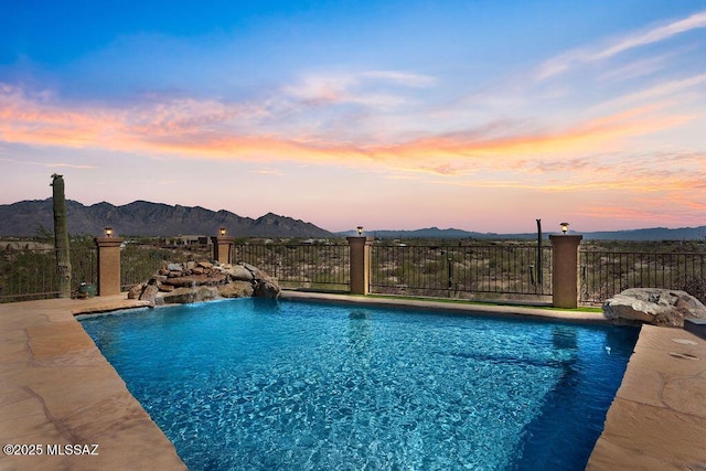 14171 N Gibson Trl, Tucson, AZ 85755 - pool at dusk with a mountain view and fence
